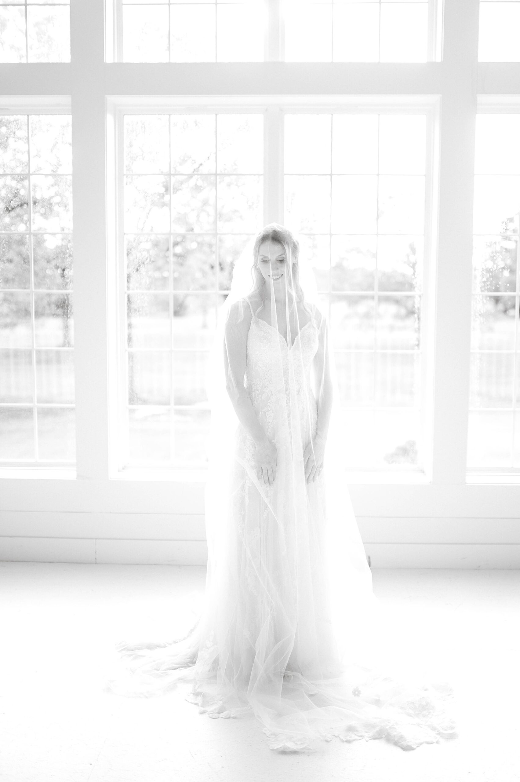 Bride in front of window