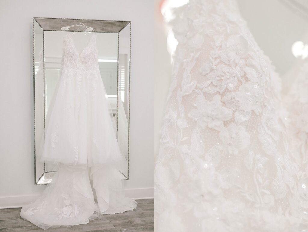 Brides dress hanging on mirror