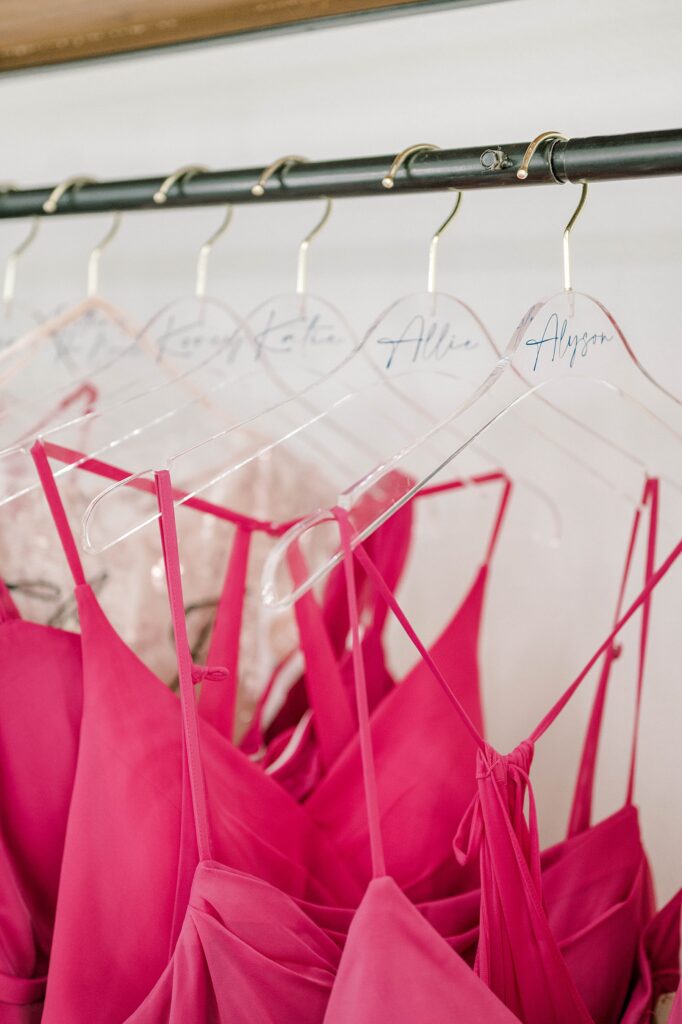 Pink bridesmaid dresses on hangers