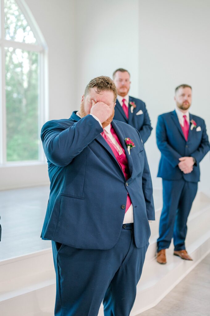 Groom reaction to seeing bride walk down the aisle